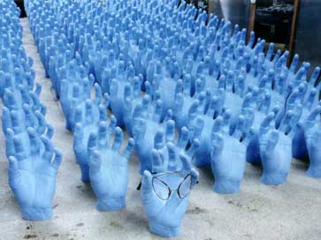 Model hands holding Flexi Specs for shop window displays